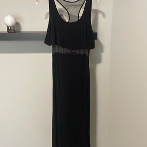 Black sleeveless maxi dress with mesh around waist and part of the back